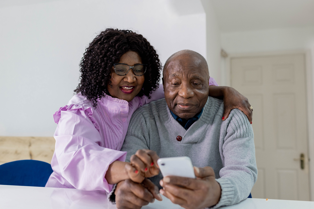 Man and woman looking at phone